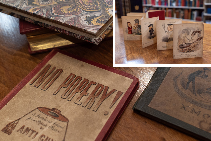 Several books lie on a table, one has a visible title, “No Popery!” An inset shows that book, in which the pages are one long accordion fold, unfolded to show the illustrations within.