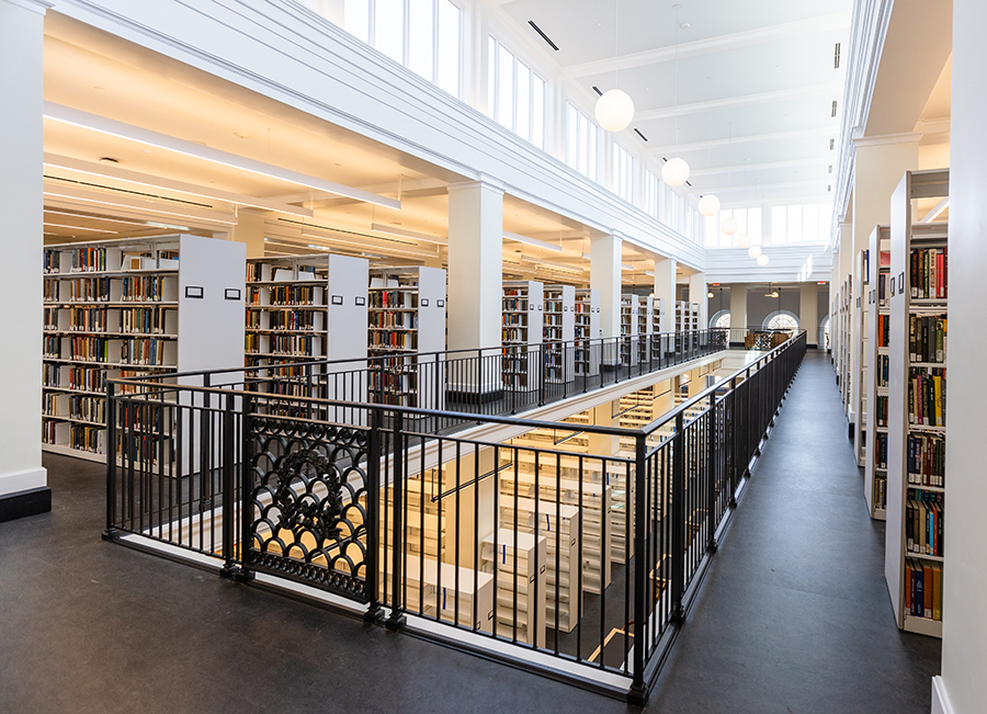Shelves full of books in a light-filled library