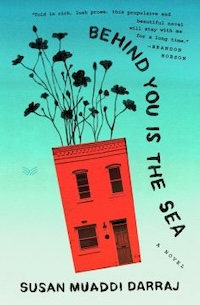 Book cover of "Behind You Is the Sea" by Susan Muaddi Darraj. The design features a red building tilted sideways with black flowers growing from it against a turquoise sky. A quote from Brandon Hobson is included.