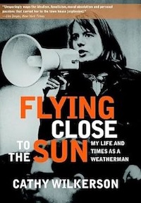 The image shows the book cover of "Flying Close to the Sun: My Life and Times as a Weatherman" by Cathy Wilkerson. The cover features a person speaking into a megaphone, with bold orange and white text.