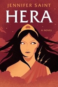 Cover of the book "Hera" by Jennifer Saint. It features an illustrated figure with dark hair and a crown, against a red background with lightning bolt accents.