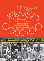 Cover of "The First Jewish Catalog: A Do-It-Yourself Kit" featuring the title in large white stylized text on a red background at the top, with a horizontal strip of black and white photos depicting various people engaged in activities below.