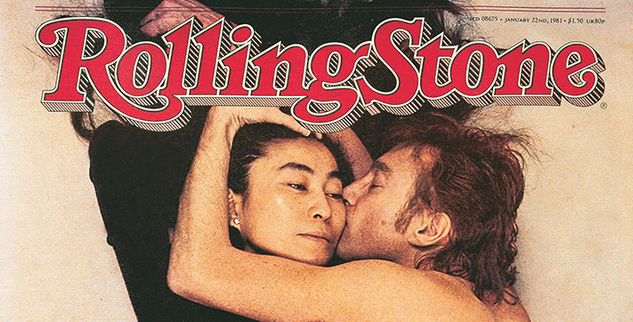 Top section of Rolling Stone magazine title banner superimposed over cover photo of John Lennon kissing his wife, Yoko Ono, his arm curled around her head.