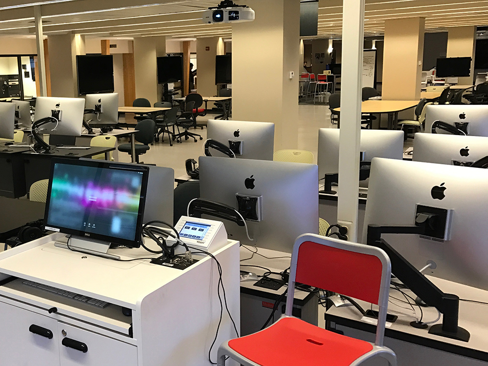 A computer lab filled with Apple computers